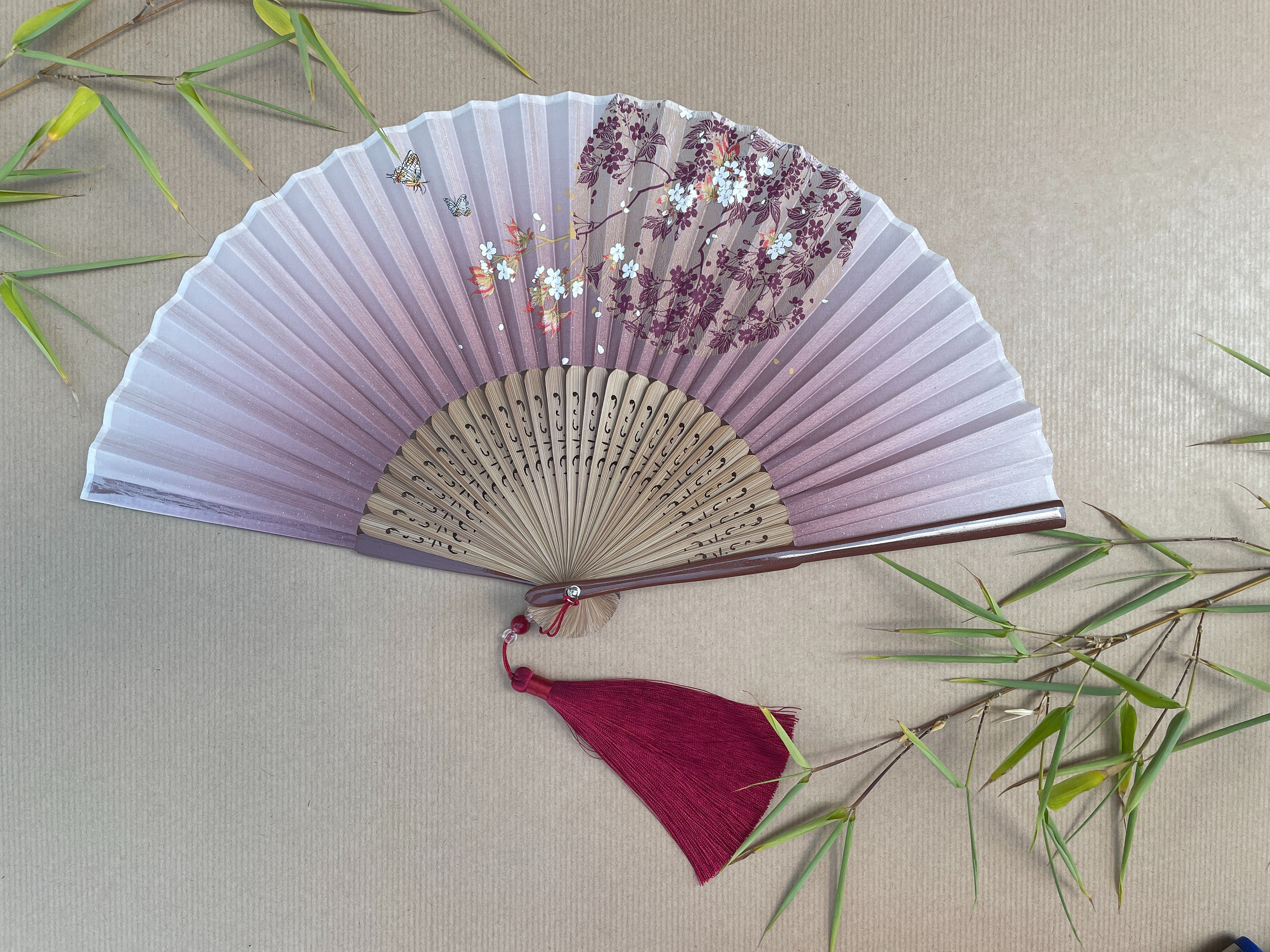 Elegant wooden hand fan with floral design